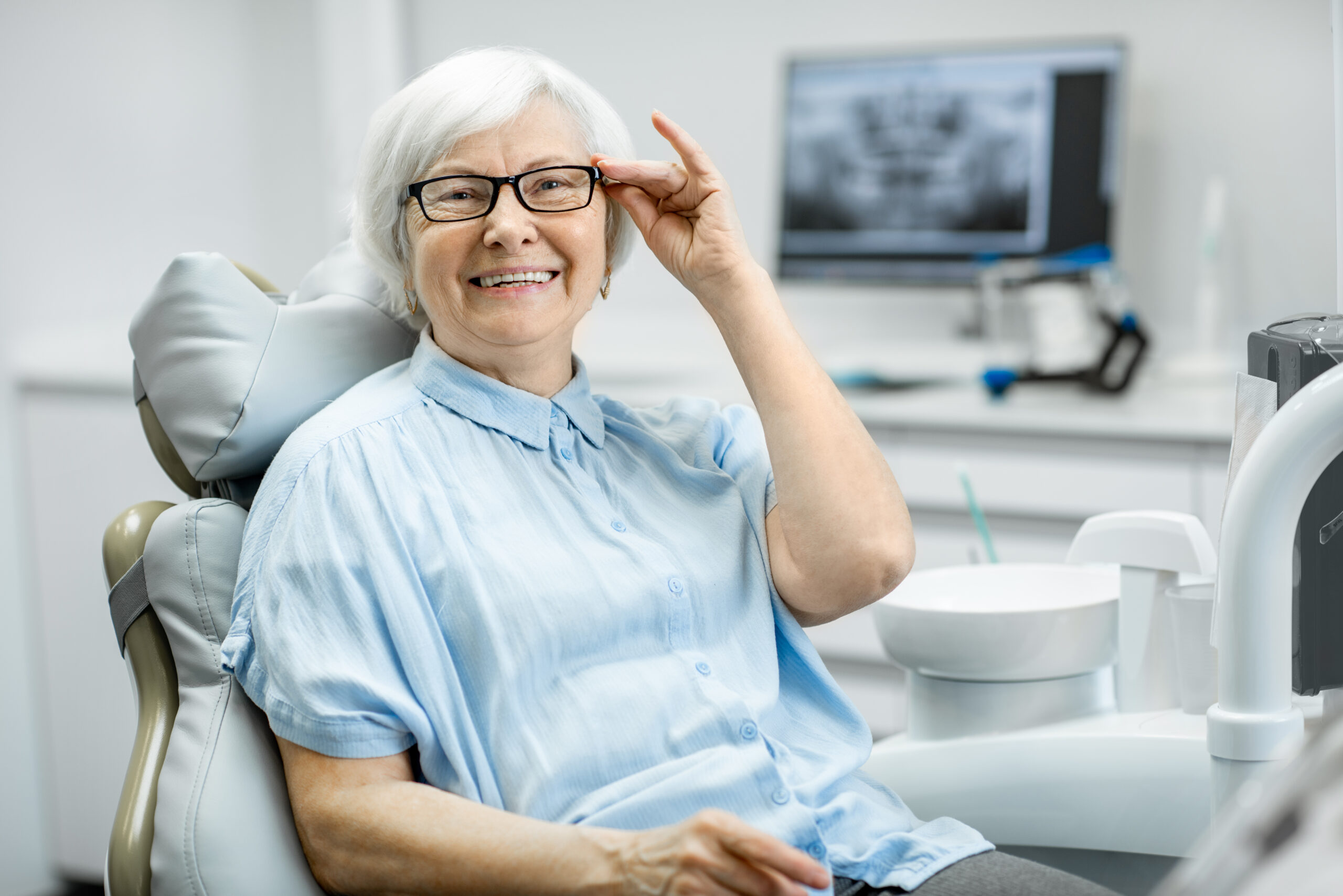 Portrait,Of,A,Beautiful,Senior,Woman,With,Healthy,Smile,Sitting