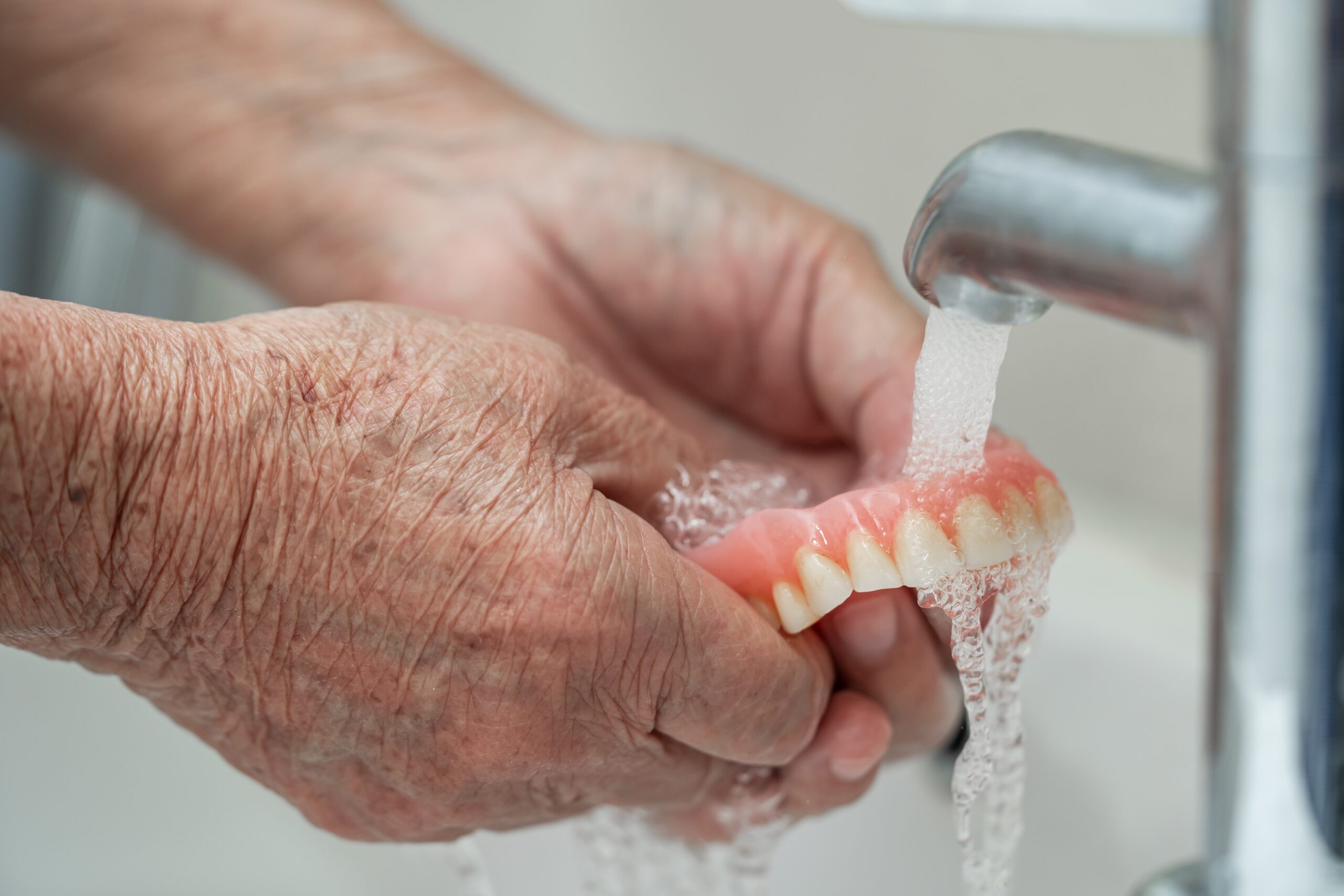 Asian,Senior,Or,Elderly,Old,Woman,Patient,Holding,And,Washing